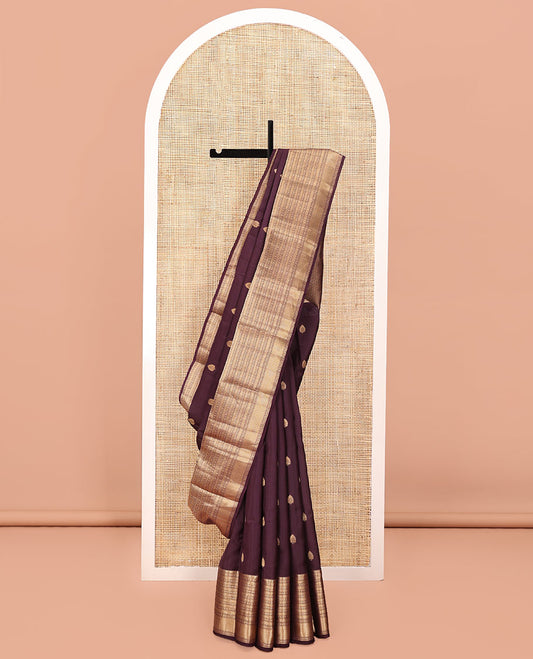 Brown Vasundhara Lite Silk Mix Saree, Ornamented with Zari Buttas All Over Its Body, Highlighted by a Zari Border of Thilakam Mokku, Poun, Kamalam, Banaras, and Mayil Kann Designs, Grand Jaal Design Pallu, and Paired with a Matching Blouse