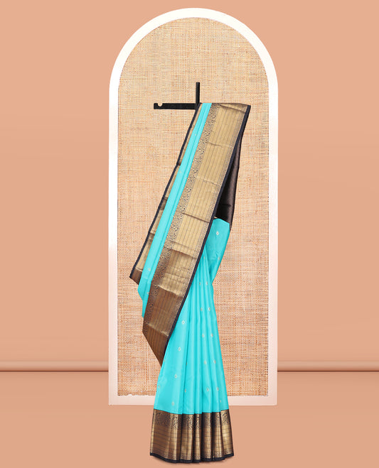 Blue Vasundhara Lite Silk Mix Saree, Accentuated with Zari Buttas, a Contrast Border of Kathir, Mayil Kann, and Kodi Visiry Designs, Jaal Pallu, and a Contrast Blouse