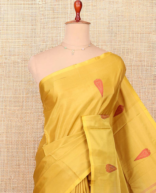 Borderless Mustard Banana Pith Saree Highlighted with Spade Buttas, Complemented by a Contrasting Pallu Steeped with Spade Buttas, and Paired with a Contrast Plain Blouse
