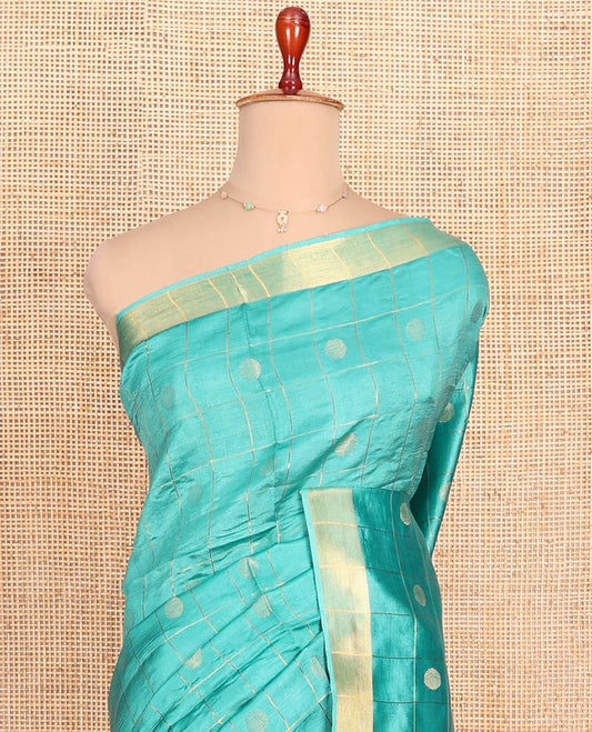 Blue Banana Pith Saree Subtly Sparkled with Polka Dot Buttas Enclosed Checks, Subtle Zari Border, Gleaming Zari Stripes Woven Pallu, and Paired with a Matching Plain Blouse