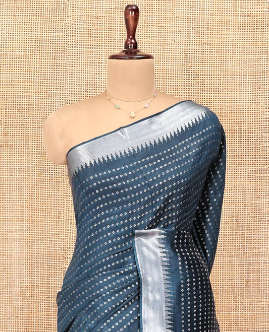 Blue Banana Pith Saree, Steeped with Buttas All Over Its Body, Highlighted by Temple Zari Border, Pallu of Gleaming Zari Stripes, and Paired with a Matching Blouse