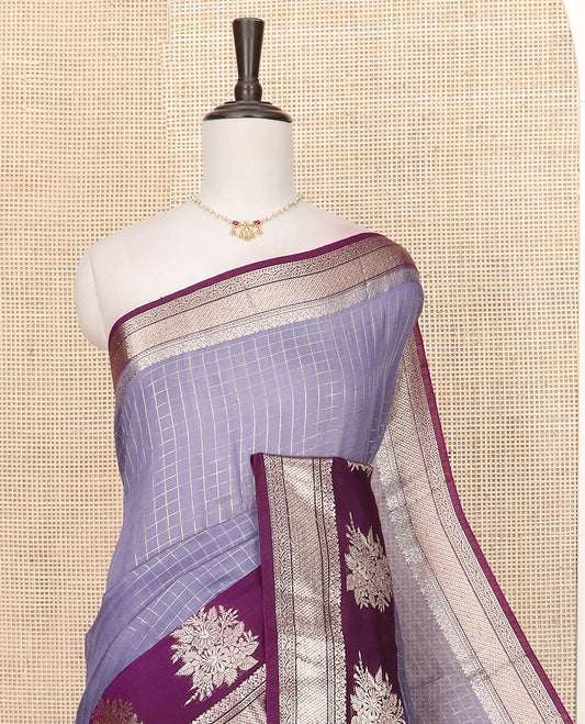 Grey Assam Silk Saree Beautifully Bedecked with Zari Checks, Complemented by Contrast Traditional Zari Border of Floral Designs, a Captivating Pallu of Zari Stripes, and Paired with a Contrast Blouse