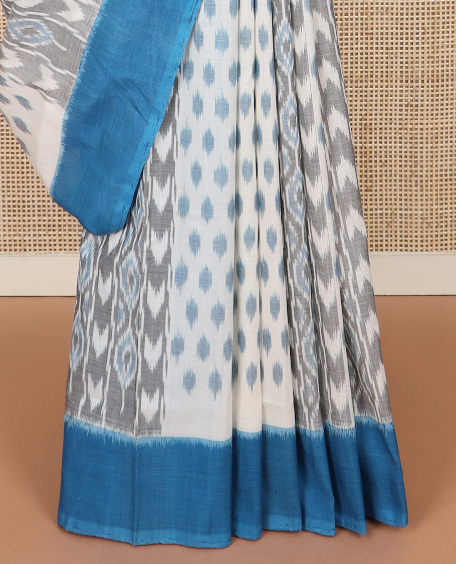 Half-white geometric design Pochampally ikkat saree, contrast plain border, and ikkat design pallu