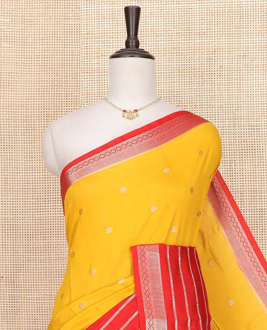 Yellow floral buttas Assam silk saree, contrast traditional zari design border, and pallu of zari stripes