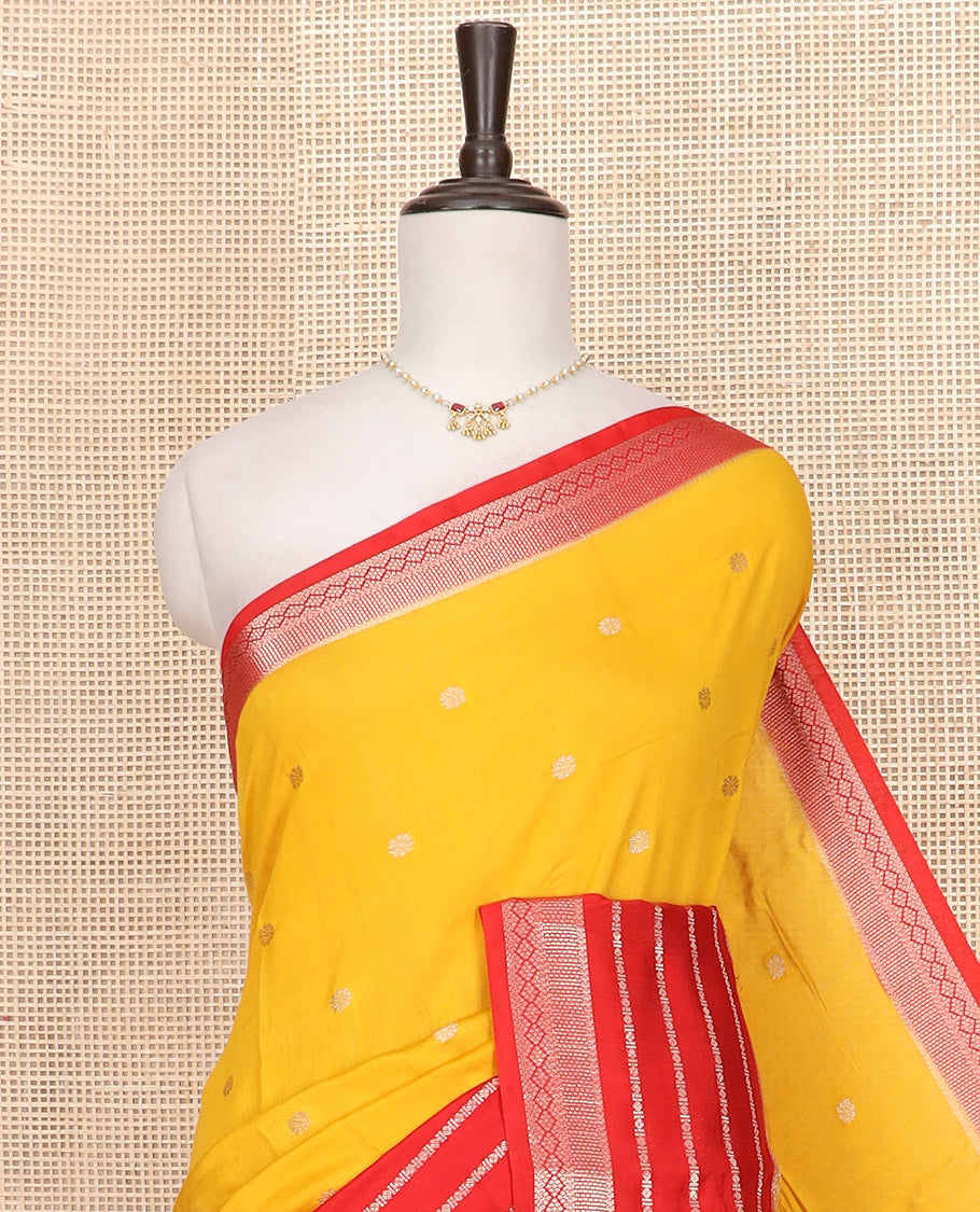 Yellow floral buttas Assam silk saree, contrast traditional zari design border, and pallu of zari stripes