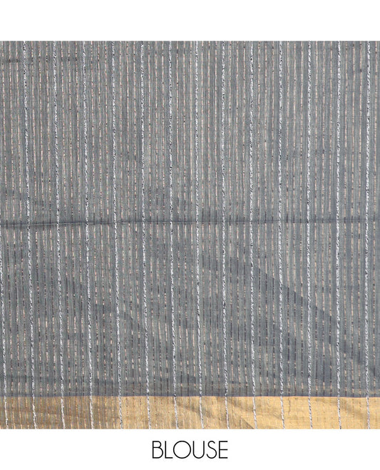 Grey plain jute cotton saree, zari bavanji border, and striped pallu