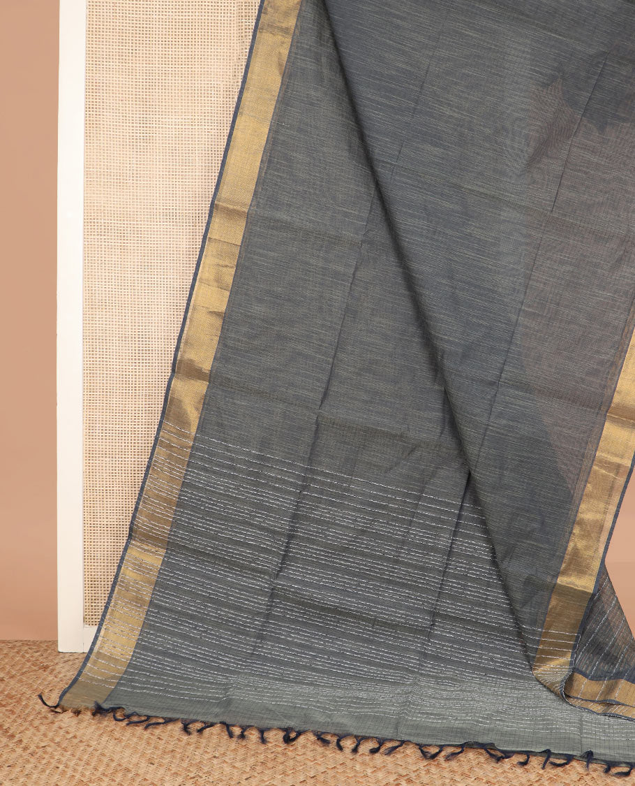 Grey plain jute cotton saree, zari bavanji border, and striped pallu
