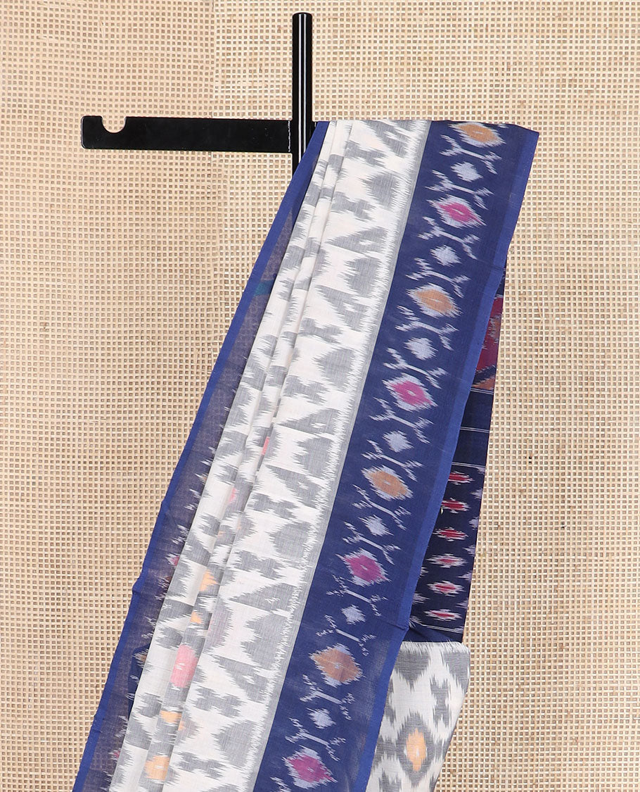 Cream-base unique motifs ikkat cotton saree, contrast ikkat buttas border & pallu of diamond & peacock designs