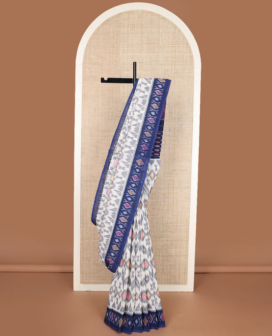 Cream-base unique motifs ikkat cotton saree, contrast ikkat buttas border & pallu of diamond & peacock designs