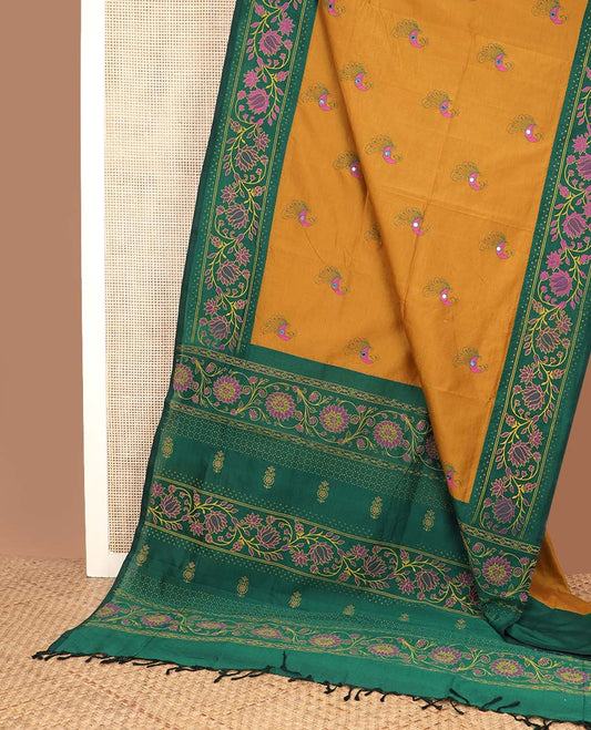 Mustard peacock motifs printed poly cotton saree, contrast floral creeper printed border, and pallu of floral creeper design
