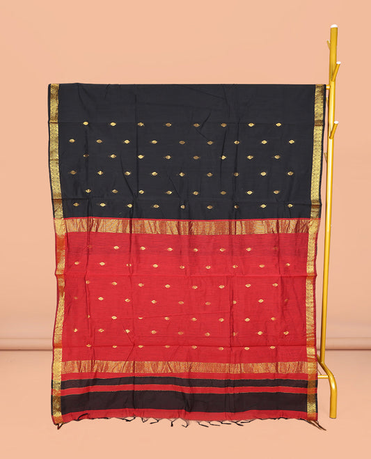 Black Maheshwari Cotton Saree, Gleamed Up with Buttas All Over Its Body, Highlighted by Zari Traditional Border, Complemented by a Contrast Pallu Steeped with Buttas, and Paired with a Contrast Blouse