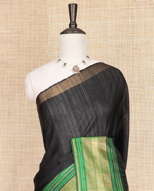 Black Plain Dupion Silk Saree, Beautifully Bedecked with a One-Sided Contrast Temple Border, Pallu Steeped with Zari Temple Designs, and Paired with a Contrast Blouse