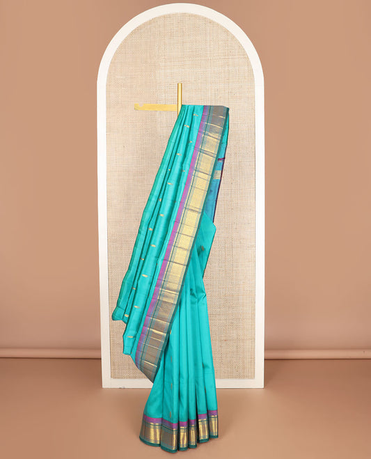Blue zari buttas kanchipuram silksaree, contrast one-sided border of paneer sombu,banaras,muthu & jaal design & zari design pallu