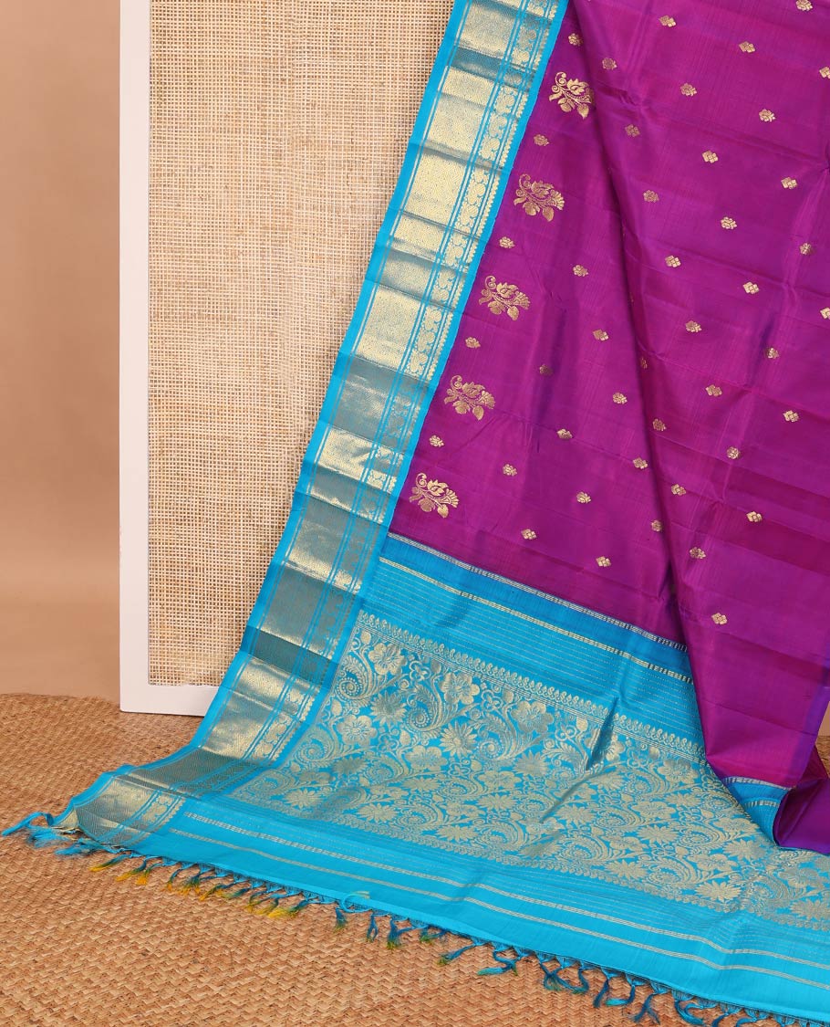 Magenta kancheepuram silk saree with zari buttas, contrast one-sided korvai border of thilakam mokku, banaras, mayil & jaal designs & floral design pallu