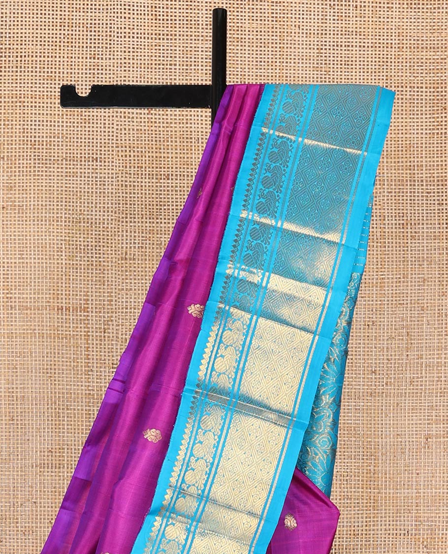 Magenta kancheepuram silk saree with zari buttas, contrast one-sided korvai border of thilakam mokku, banaras, mayil & jaal designs & floral design pallu