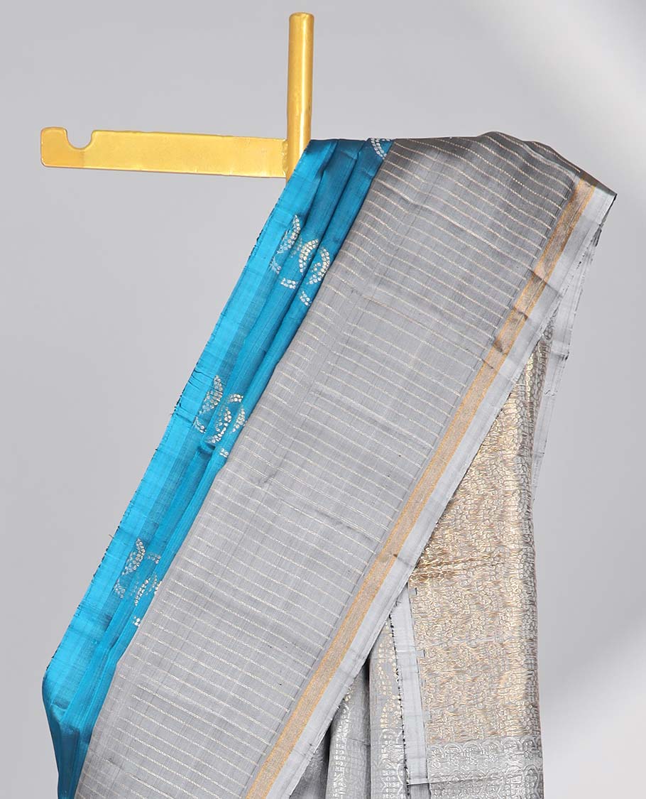 Blue  intricate design soft silk saree with contrast striped border & leaf design pallu