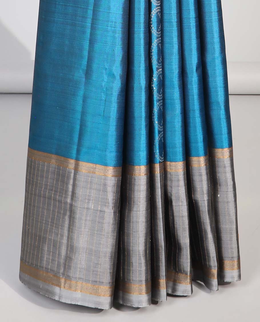 Blue  intricate design soft silk saree with contrast striped border & leaf design pallu