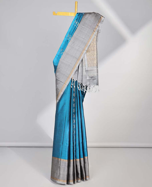 Blue  intricate design soft silk saree with contrast striped border & leaf design pallu