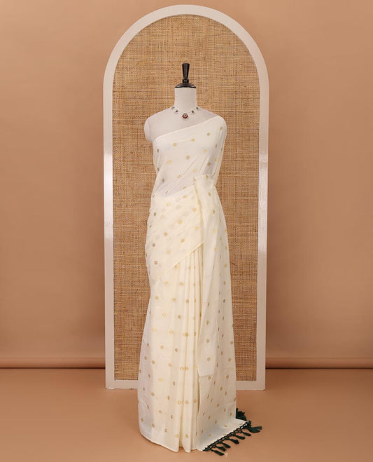 Borderless Kerala cream all over zari buttas saree, zari design pallu with green tussels & zari buttas blouse