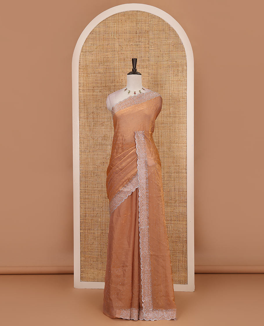 Peach Swarovski crystal stone embedded fendy chiffon saree, scallop Swarovski stone embroidered border, and contrast plain blouse