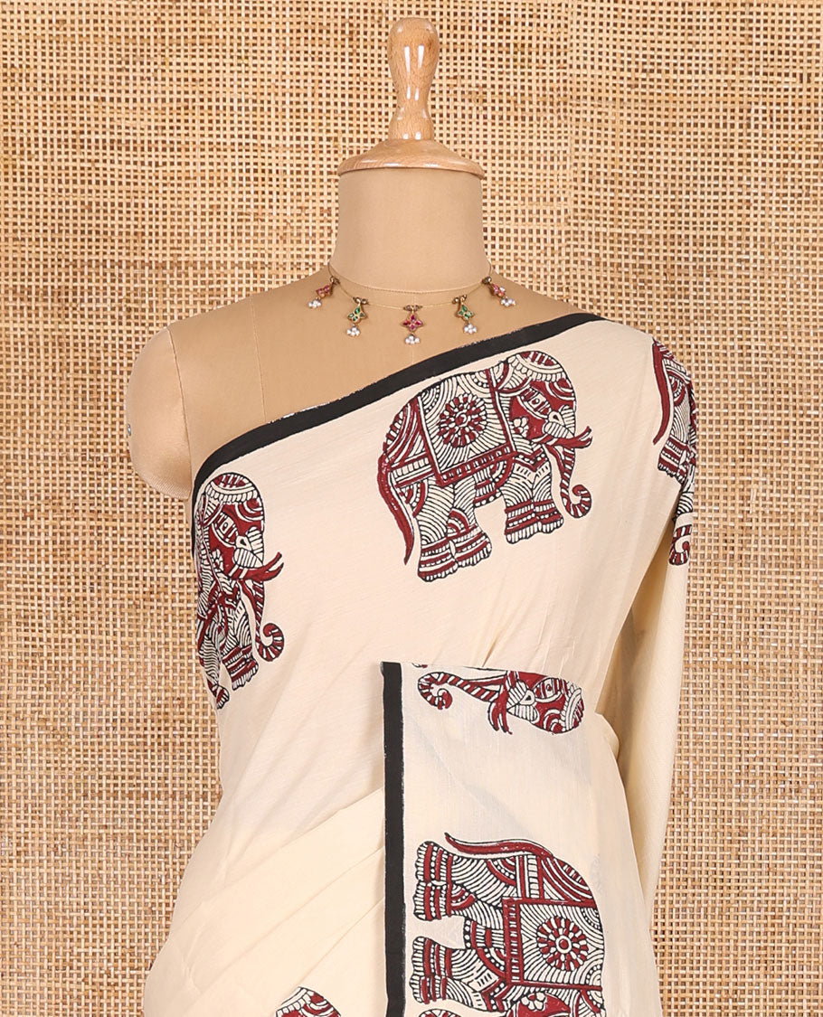 Cream plain South cotton saree with double-sided block printed borders of elephant motifs, and a matching printed blouse