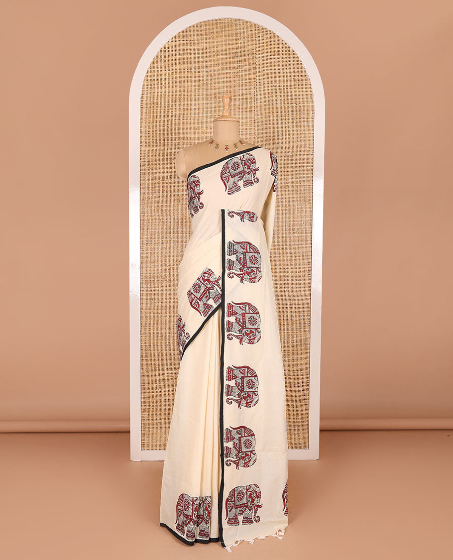 Cream plain South cotton saree with double-sided block printed borders of elephant motifs, and a matching printed blouse