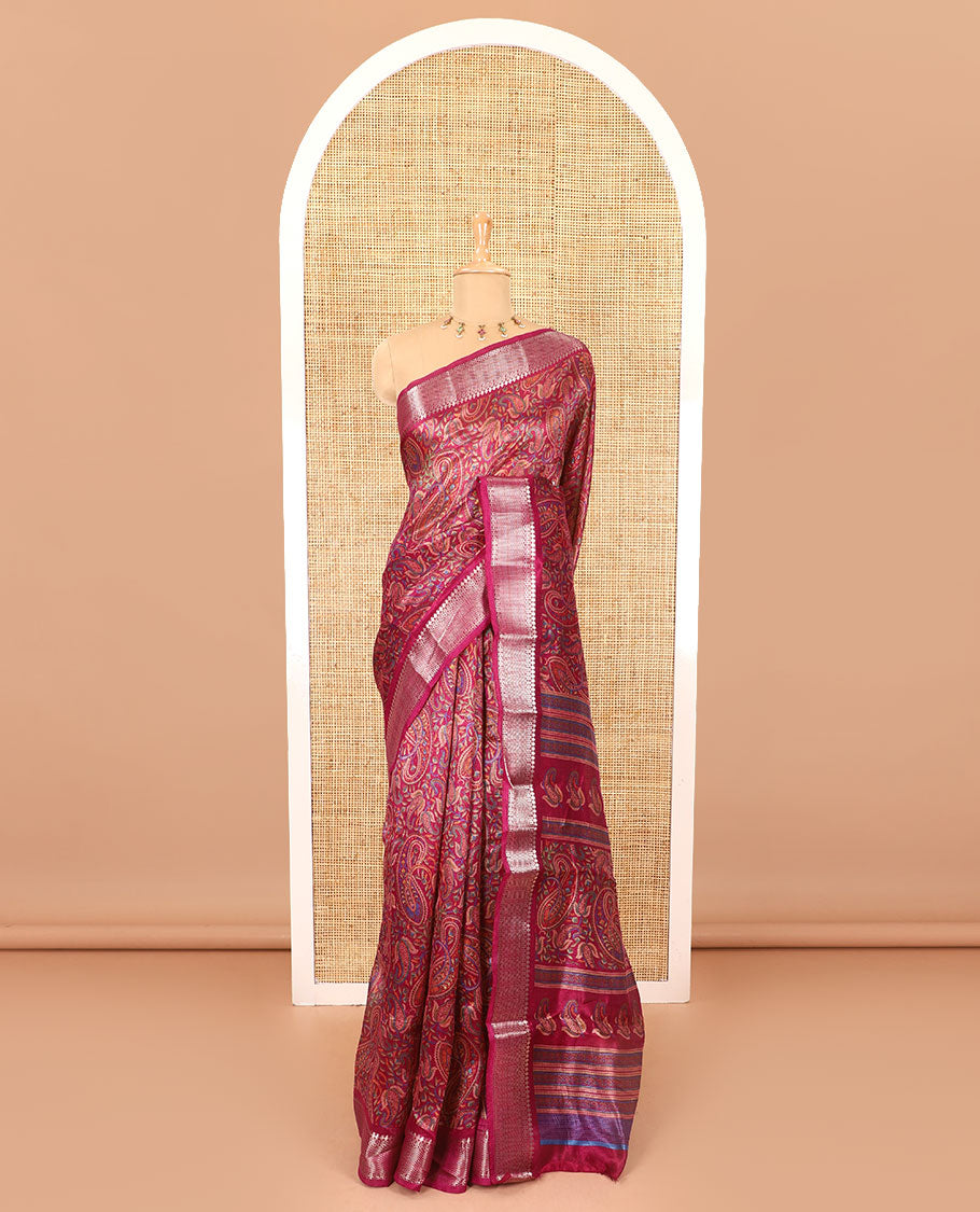 Magenta paisley motifs printed green silk saree, traditional zari border, paisley printed pallu, and a matching blouse