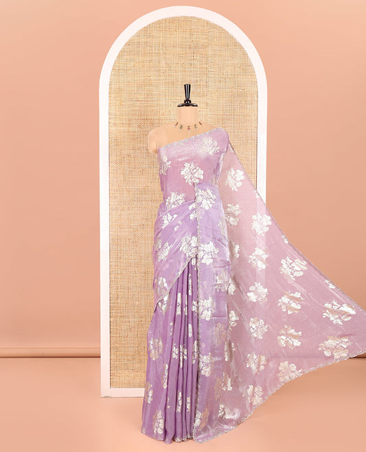 Lavender Fendi Satin Saree Prettified with Floral Motifs in Golden Foil Prints, Sparkling Scallop Swarovski Stone Work Border, Pallu of the Same Foil Prints, and Comes with a Matching Colored Stone Work Blouse
