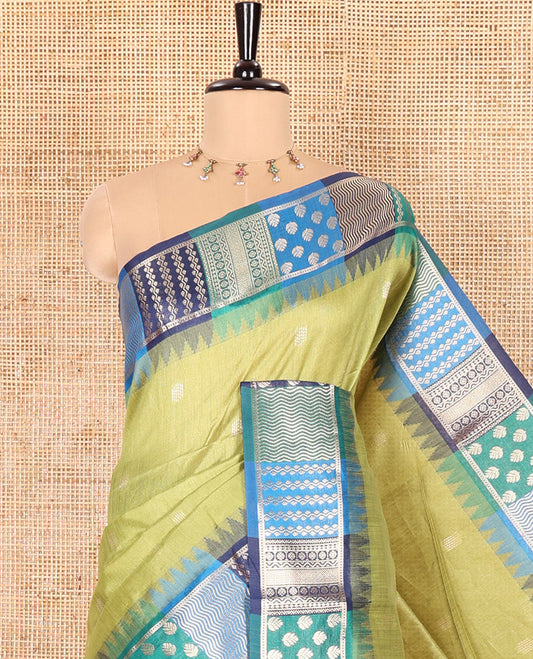 Green Semi-Raw Silk Saree, Adorned with Buttas All Over Its Body, Complemented by Contrast Meenakari-Style Woven Border of Geometric Zari Designs, Majestically Detailed Pallu, and Paired with a Contrast Blouse