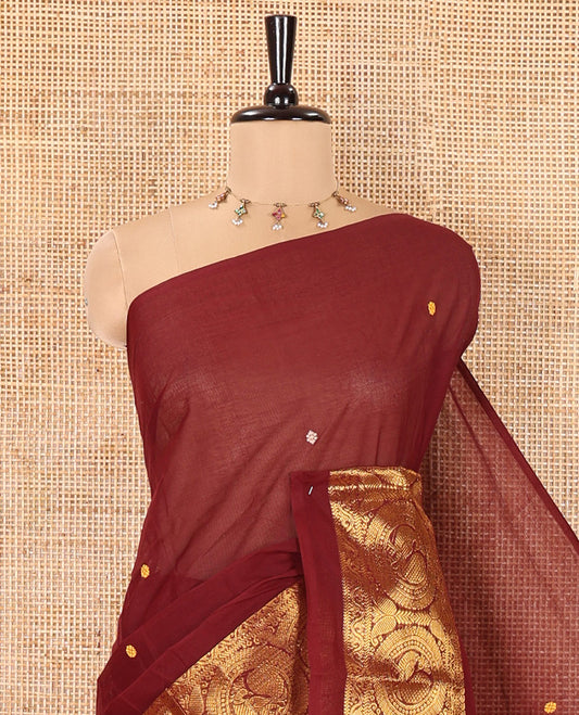 Coffee Brown Chettinad Cotton Saree, Subtly Sparkled with Buttas All Over Its Body, Highlighted Contrast by Zari Traditional Border of Round Chakram Designs, Pallu of Stripes and Buttas, and Paired with a Matching Blouse