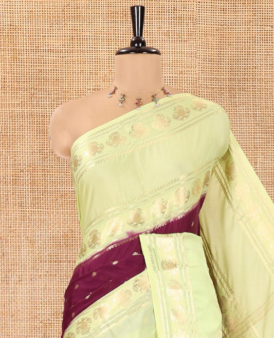 Purple Art Mysore Silk Saree, Accentuated with Zari Buttas All Over Its Body, Complemented by a Contrast Rettai Pettu Border of Two-Headed Eagle Designs, Pallu Steeped with Buttas and Stripes, and Paired with a Contrast Blouse