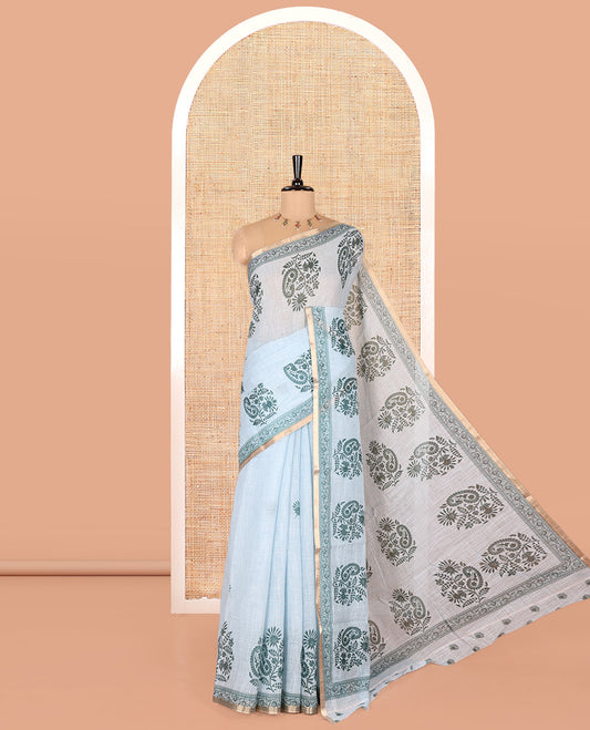 Blue Linen Cotton Saree, Artfully Designed with Floral-Paisley Motifs Print All Over Its Body, Highlighted by Gold Zari Printed Border, Floral-Paisley Printed Pallu and Paired with a Matching Blouse