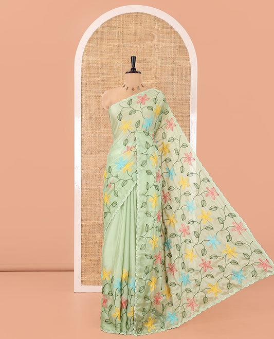 Pista Green Rangoli Chiffon Saree, Crafted with Multi-Color Floral Vine Embroidery on Its Body, Floral Embroidered Pallu, and Contrast Floral Embroidered Blouse