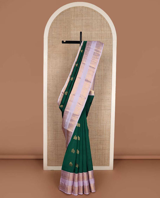 Green zari buttas Vasundhara silk mix saree, contrast rettai pettu border of thilakam, diamond, neli, muthu, and mayil designs, and jaal pallu