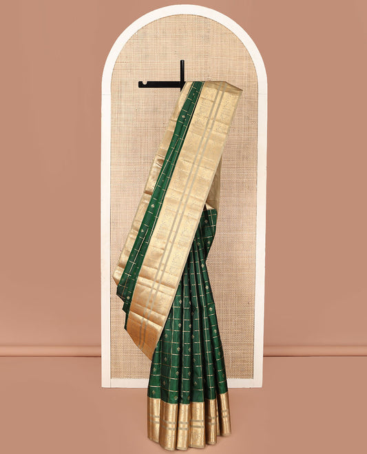 Green Vasundhara Silk Saree, Beautified with Zari Butta Enclosed Checked Designs on Its Body, Complemented by a Contrast Border of Muthu, Banaras, and Mayil Designs, Ogee-Patterned Pallu, and Paired with a Contrast Blouse