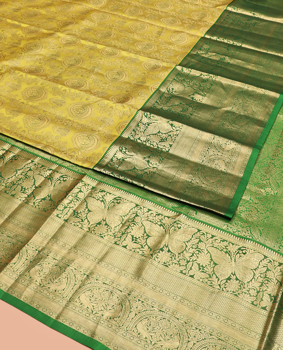 Yellow Kanchipuram Silk Saree Adorned with Jacquard Design, Complemented by Contrast Border of Rekku, Kathir, Mayil, Butterfly, and Then Kuli Kann Designs, Pallu Woven with Intricate Zari Designs, and Paired with a Contrast Blouse