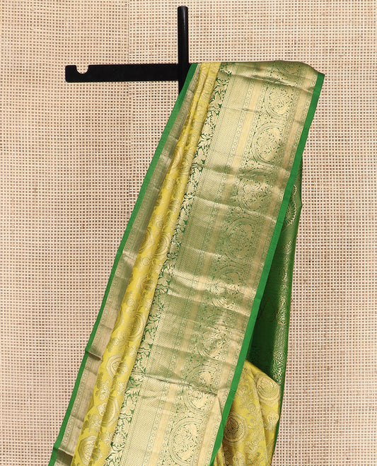 Yellow Kanchipuram Silk Saree Adorned with Jacquard Design, Complemented by Contrast Border of Rekku, Kathir, Mayil, Butterfly, and Then Kuli Kann Designs, Pallu Woven with Intricate Zari Designs, and Paired with a Contrast Blouse