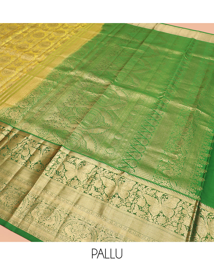 Yellow Kanchipuram Silk Saree Adorned with Jacquard Design, Complemented by Contrast Border of Rekku, Kathir, Mayil, Butterfly, and Then Kuli Kann Designs, Pallu Woven with Intricate Zari Designs, and Paired with a Contrast Blouse