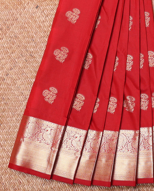 Red Budget Silk Saree, Decorated with Buttas All Over Its Body, Highlighted by Traditional Zari Design Border of Peacocks, Jaal Pallu, and Paired with a Matching Blouse