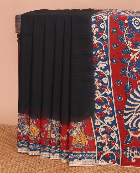 Black plain machine-printed kalamkari cotton saree, contarst human figurines printed border & pallu of peacock & floral vine print
