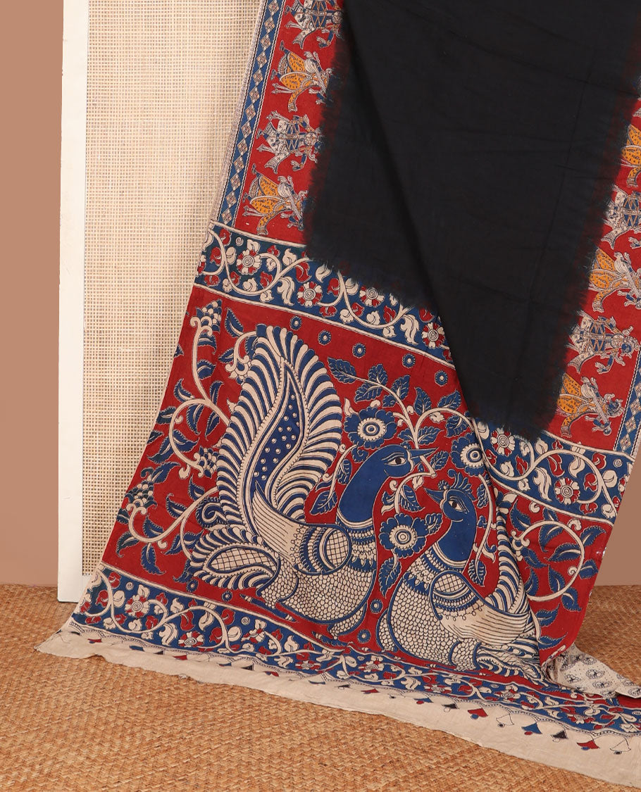 Black plain machine-printed kalamkari cotton saree, contarst human figurines printed border & pallu of peacock & floral vine print