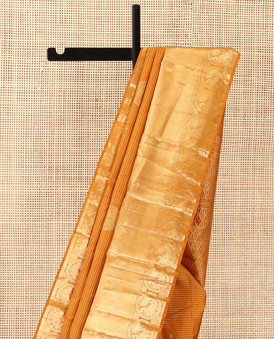 Mustard zari stripes and buttas Kanchipuram silk saree,  zari border of thilakam, paisa, round mayil, and mayil kann designs, and jaal pallu
