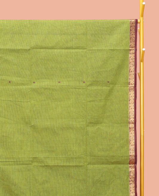 Green Chettinad Cotton Saree, Bedecked with Thread Buttas All Over Its Body, Complemented by a Contrast Traditional Zari Design Border, Pallu of Stripes, and Buttas, and Paired with a Matching Blouse