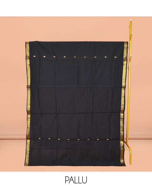 Black Maheshwari Cotton Saree, Gleamed Up with Buttas All Over Its Body, Highlighted by Zari Traditional Border, Complemented by a Contrast Pallu Steeped with Buttas, and Paired with a Contrast Blouse