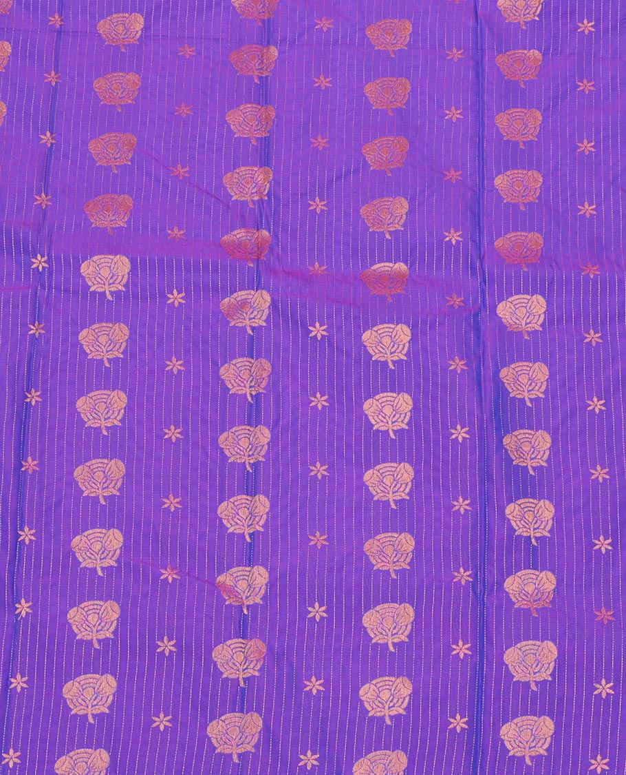 Violet Art Silk Pavadai Material Set, Richly Detailed with Zari Stripes and Floral Buttas on Its Skirt, Complemented by a Contrast Traditional Zari Design Border, and Paired with a Contrast Blouse