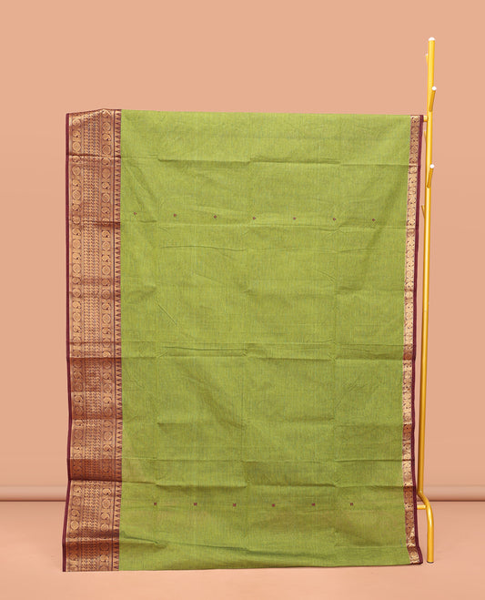Green Chettinad Cotton Saree, Bedecked with Thread Buttas All Over Its Body, Complemented by a Contrast Traditional Zari Design Border, Pallu of Stripes, and Buttas, and Paired with a Matching Blouse