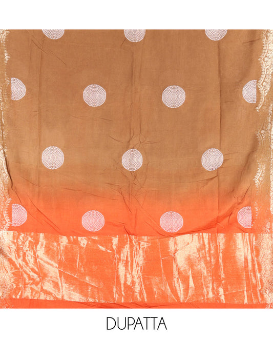Orange Semi Silk Material Churidar Set, Subtly Made Plain Top, a Plain Santoon Bottom, and Is Paired with a Dual-Colored Bandhani Motifs Semi Silk Dupatta