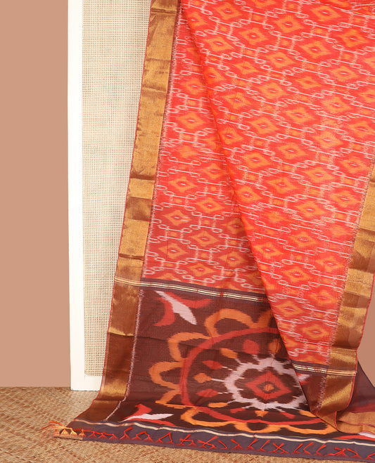 Orange Ikkat Cotton Saree, Highlighted by Ikkat-Style Kolam Designs All Over Its Body, Complemented by a Contrast Border, Pallu of Rangoli Designs in Ikkat Weave, and Paired with a Contrast Blouse