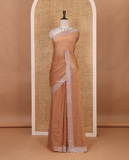 Peach Swarovski crystal stone embedded fendy chiffon saree, scallop Swarovski stone embroidered border, and contrast plain blouse