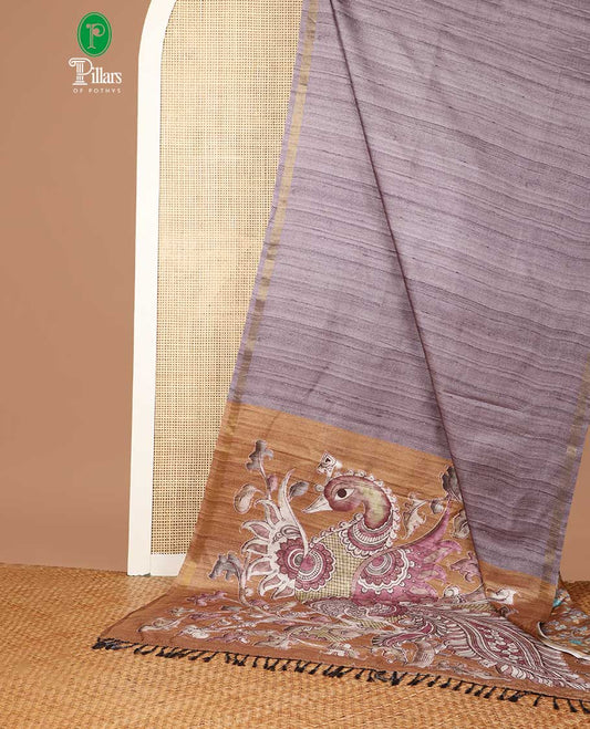 Grey semi kicha tussar saree with small zari border & kalamkari pallu along with floral printed blouse